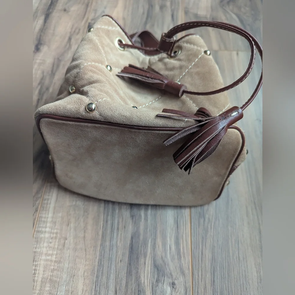 Claudia Firenze Leather Bucket Bag With Pull Top And Tassels.